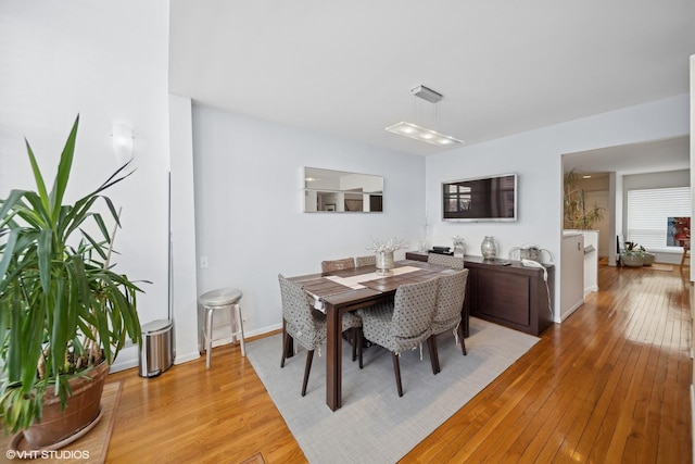 dining area with light wood-type flooring