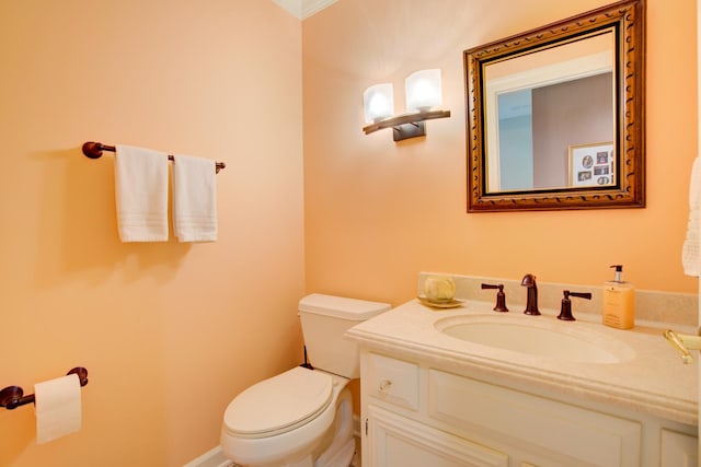 half bath featuring toilet and vanity