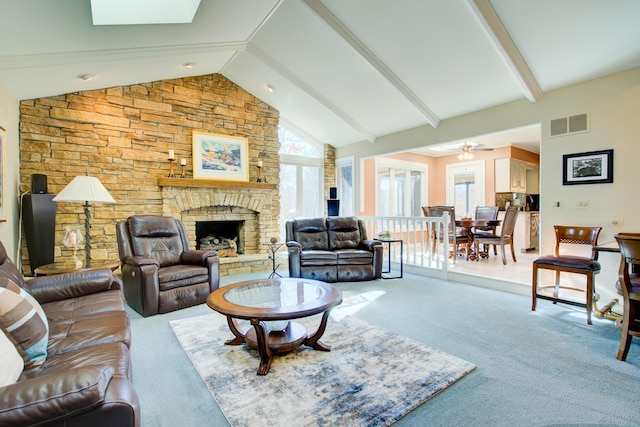 living room featuring visible vents, high vaulted ceiling, a fireplace, light carpet, and beamed ceiling