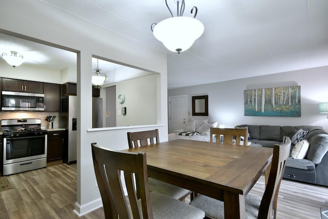 dining room with light hardwood / wood-style flooring