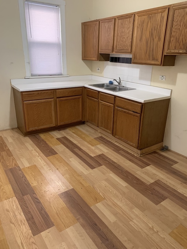 kitchen featuring sink and light hardwood / wood-style flooring