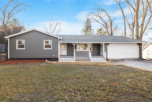 single story home with a porch, a front lawn, and a garage