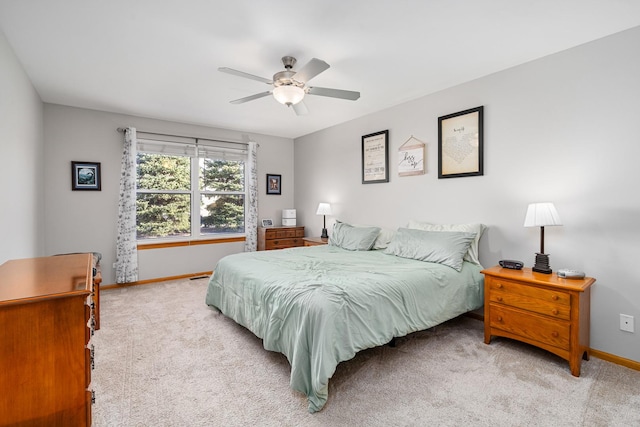 bedroom with light colored carpet and ceiling fan