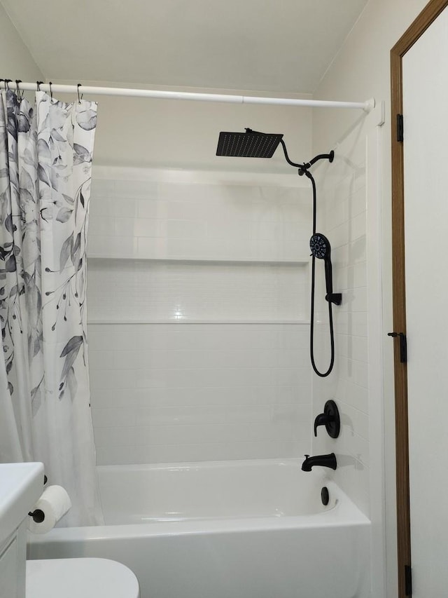 bathroom with toilet and shower / bath combo