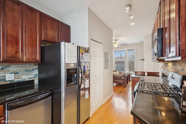 kitchen featuring stainless steel appliances, ceiling fan, light hardwood / wood-style floors, and decorative backsplash