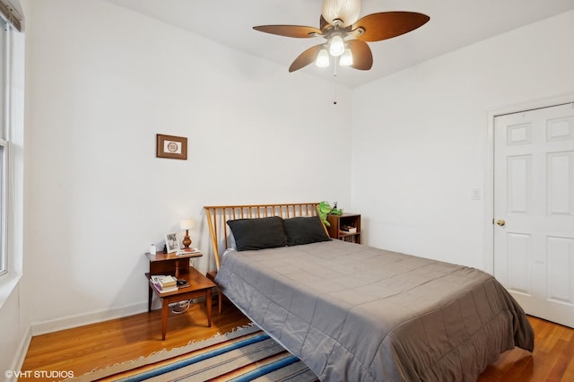 bedroom featuring light wood-type flooring and ceiling fan