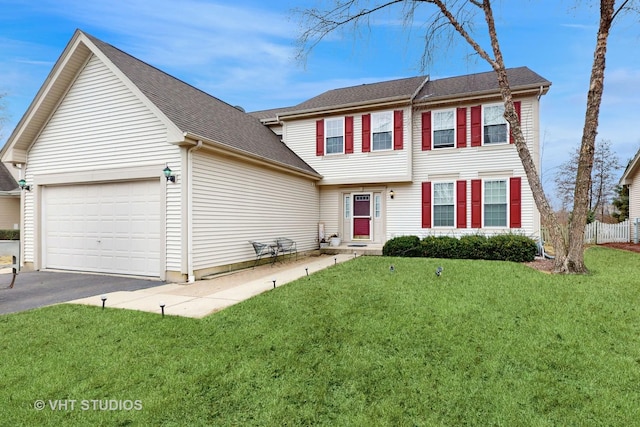 view of front of home featuring a garage and a front lawn