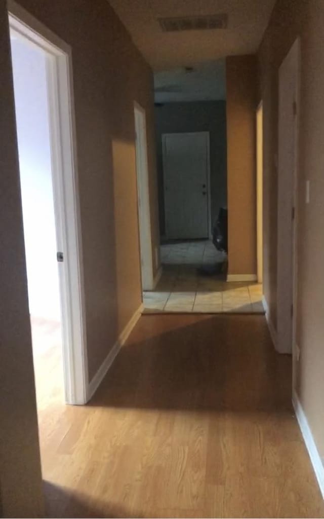 hallway featuring light hardwood / wood-style flooring