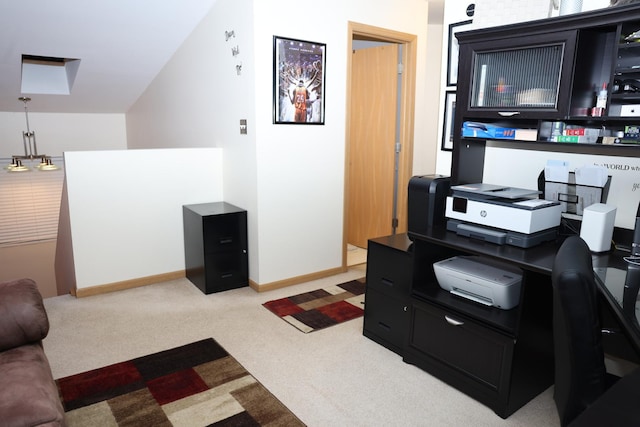 carpeted office with lofted ceiling