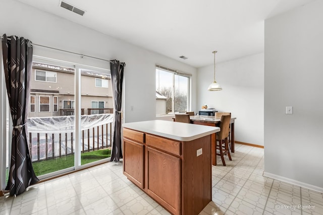 kitchen featuring pendant lighting and a center island