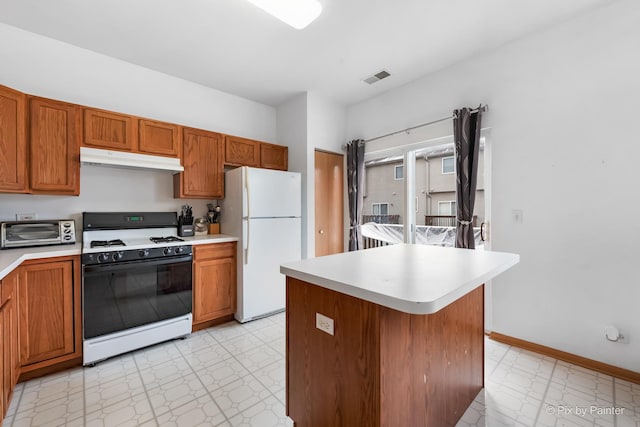 kitchen with white appliances and a center island