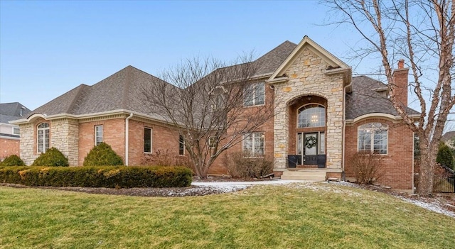 french country style house with a front yard