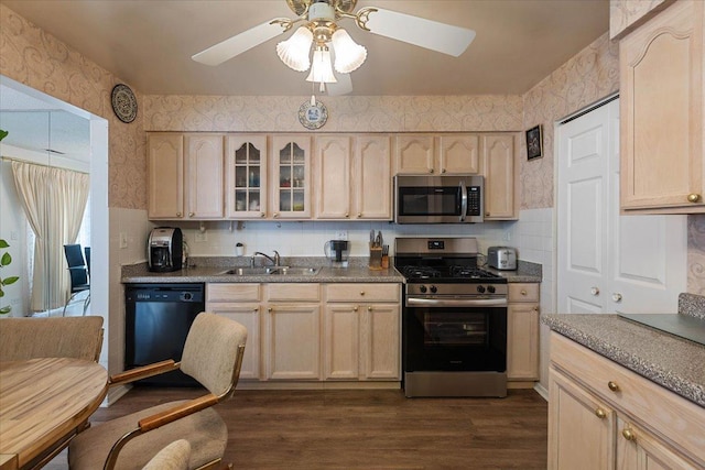 kitchen with sink, stainless steel appliances, ceiling fan, and light brown cabinetry