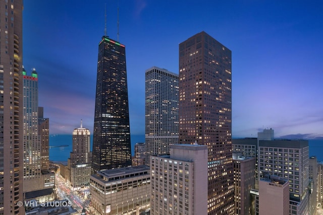 property's view of city with a water view