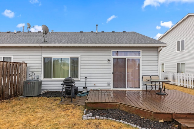 back of house with a deck, central AC, a shingled roof, and fence