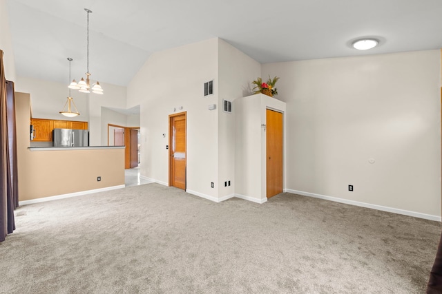 interior space with high vaulted ceiling, baseboards, visible vents, and a chandelier