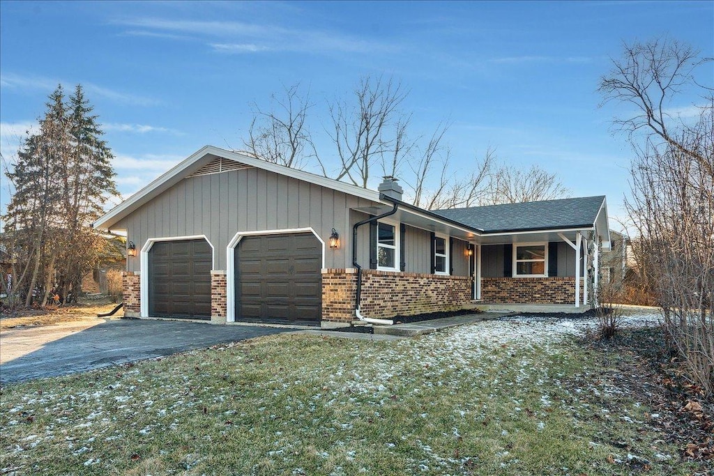 ranch-style house featuring a garage