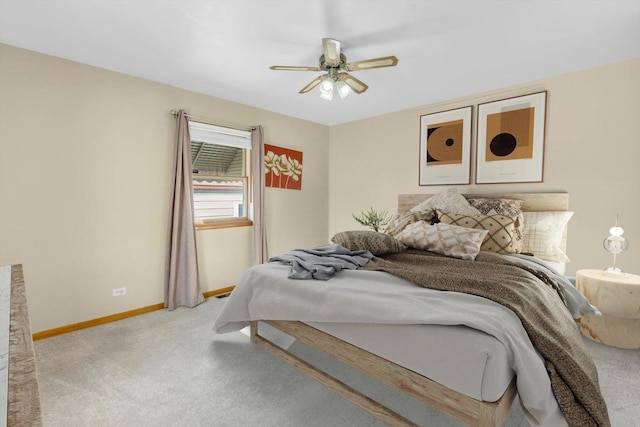 bedroom featuring light carpet and ceiling fan