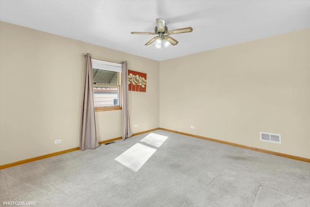 carpeted empty room with ceiling fan