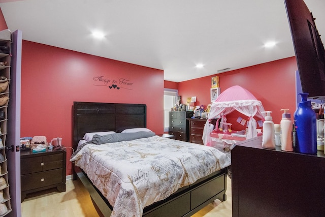 bedroom with light hardwood / wood-style flooring