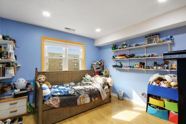 bedroom with light hardwood / wood-style floors