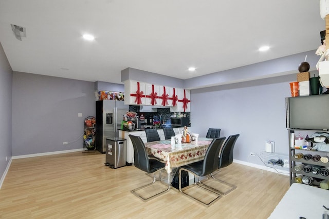 dining space featuring light hardwood / wood-style floors