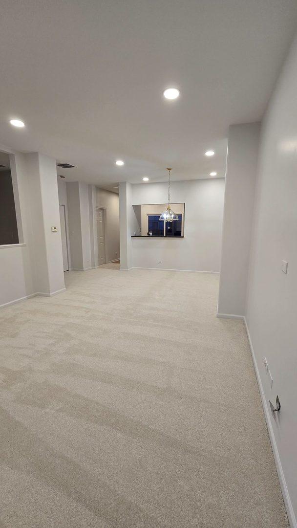 basement with light colored carpet