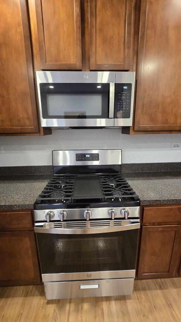 kitchen featuring light wood-type flooring and stainless steel appliances