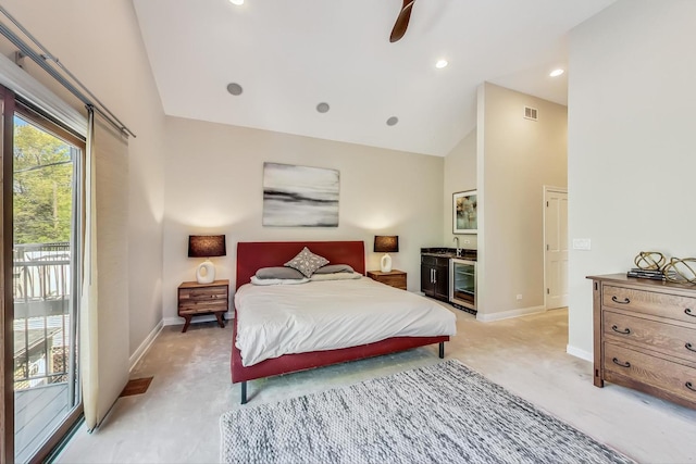 bedroom with access to exterior, ceiling fan, high vaulted ceiling, and wine cooler