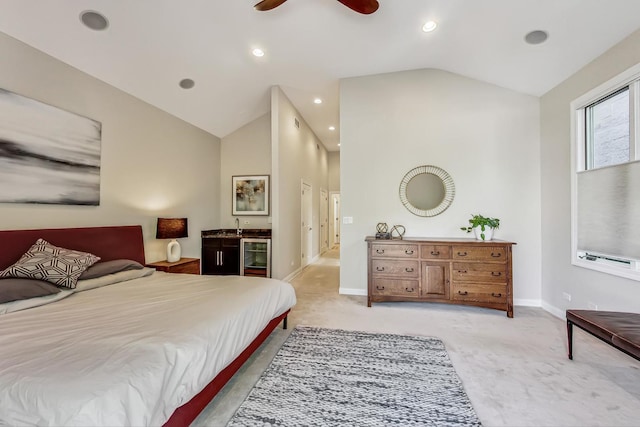 carpeted bedroom featuring ceiling fan and vaulted ceiling