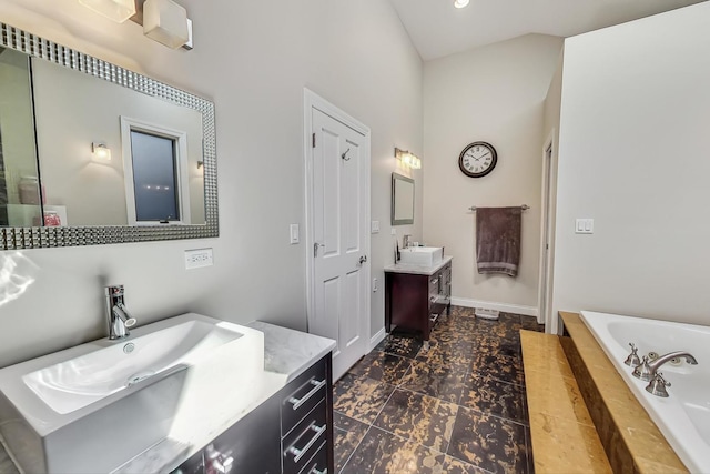 bathroom with vanity and a bathing tub