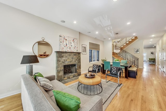 living room featuring a fireplace and light hardwood / wood-style flooring