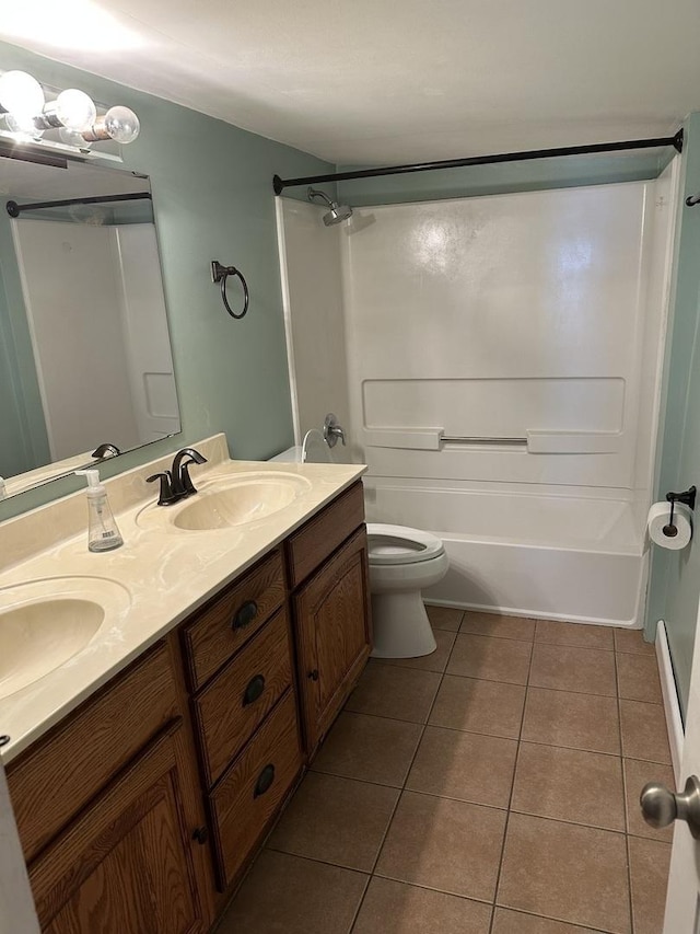 full bathroom with washtub / shower combination, tile patterned floors, vanity, and toilet