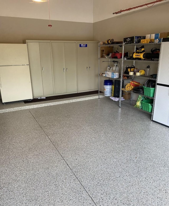 garage with white refrigerator