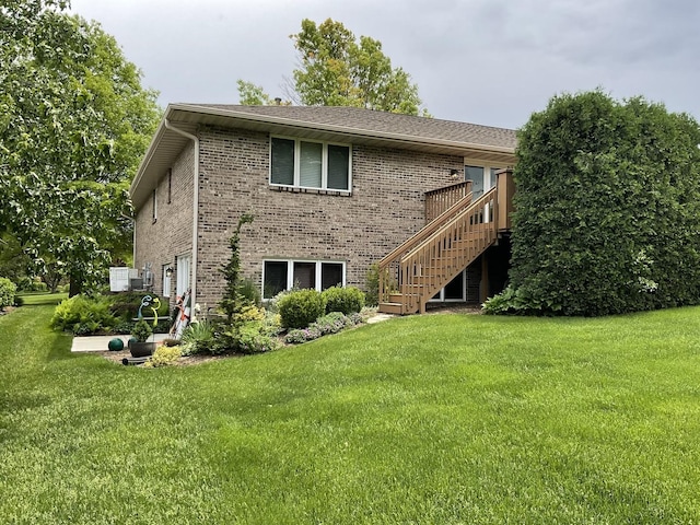 rear view of house with a lawn