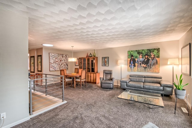 living room featuring dark colored carpet