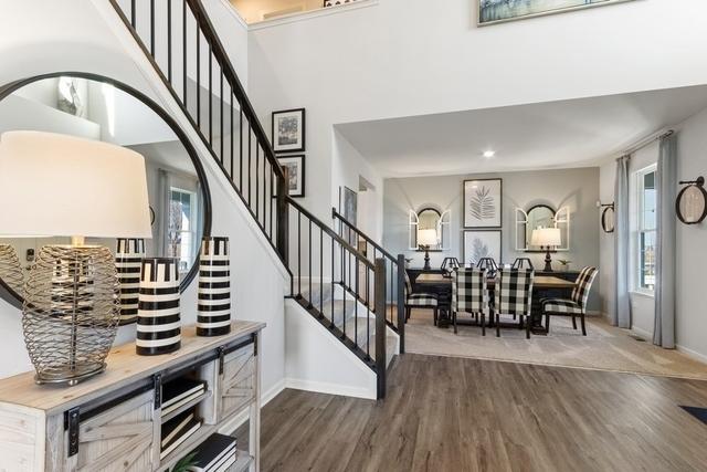 stairs with hardwood / wood-style flooring