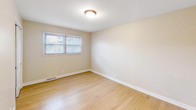 unfurnished room featuring light hardwood / wood-style flooring