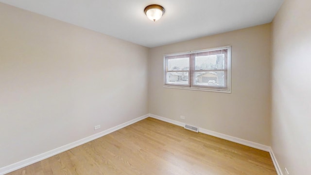 empty room with light hardwood / wood-style floors