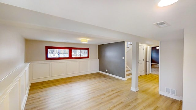 spare room featuring light wood-type flooring