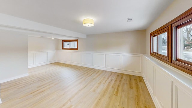 unfurnished room with light hardwood / wood-style floors