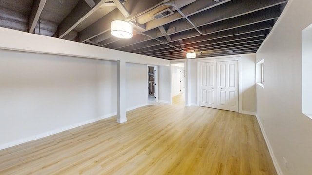 basement featuring hardwood / wood-style floors