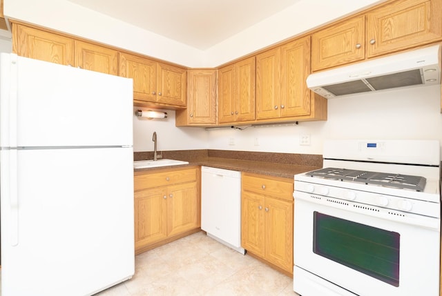 kitchen featuring white appliances and sink