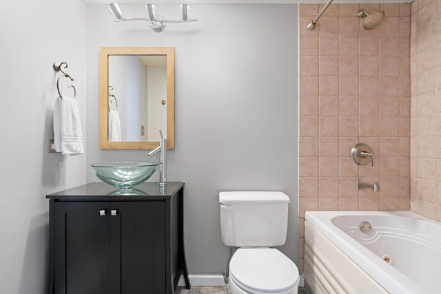 full bathroom featuring vanity, toilet, and tiled shower / bath