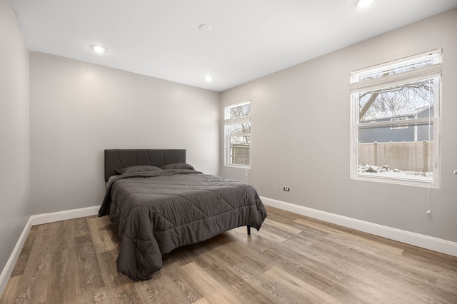 bedroom with light wood-type flooring