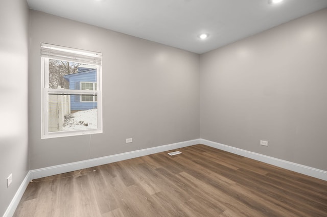 empty room featuring hardwood / wood-style flooring