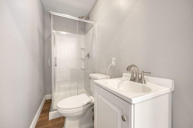 full bathroom featuring combined bath / shower with glass door, vanity, and toilet