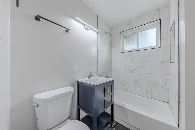 full bathroom with tiled shower / bath, tile patterned floors, vanity, and toilet