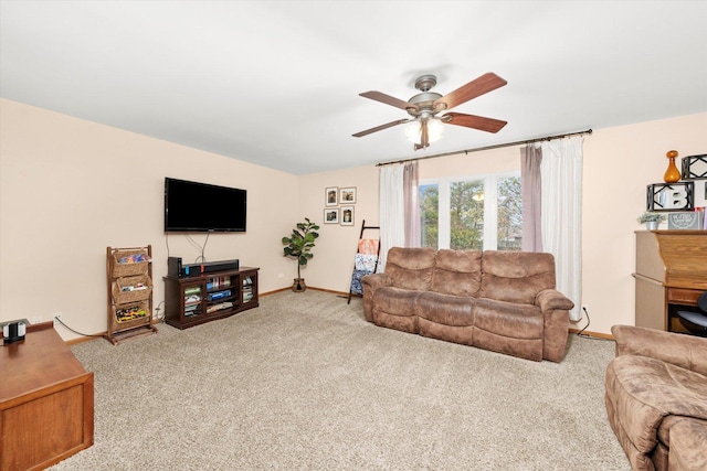 living room with ceiling fan and light colored carpet