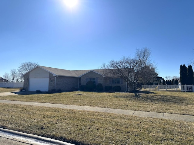 single story home featuring an attached garage, fence, and a front yard